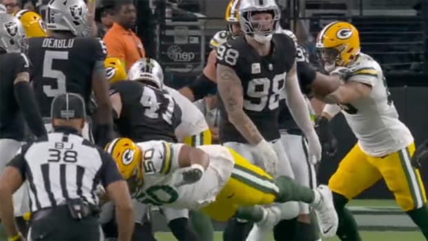 Packers offensive lineman Zach Tom flops after contact from Raiders DE Maxx Crosby.